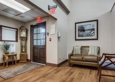 Interior corner of a lobby with seating and clock