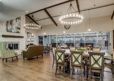 Bright and welcoming common area with seating and tables