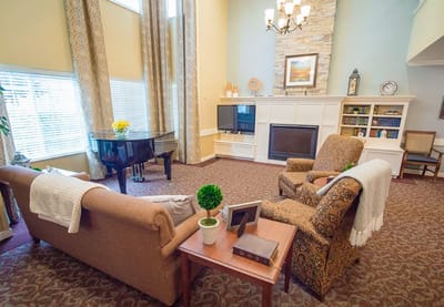 Bright common area with piano and seating