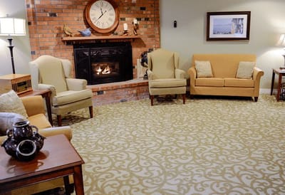 Cozy common area with seating and a fireplace