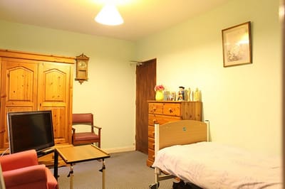 A private resident room with furniture and decor