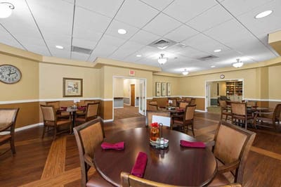 Dining area with tables set for residents