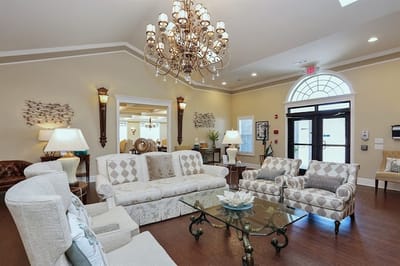 Bright common area with elegant furniture and chandelier