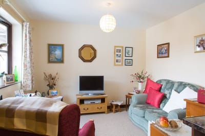 Cozy living room with a television and comfortable seating