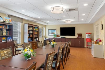 A bright common area with tables and decor