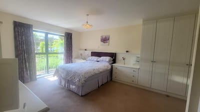Bright and cozy resident bedroom with a view