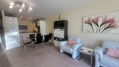 Bright interior common area with seating and dining table