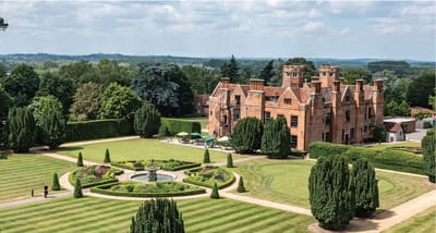 Aerial view of a large retirement facility and gardens