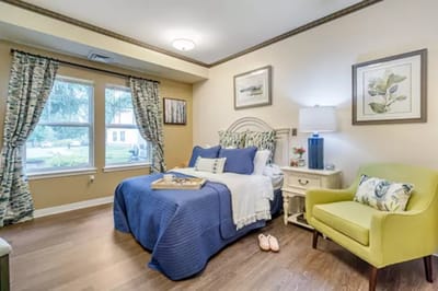 Cozy resident room with bed and seating area