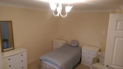 Cozy private resident room with light-colored walls