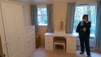 Resident's room with furniture and natural light
