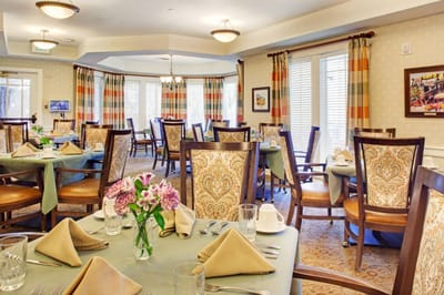 Dining room with tables set for residents