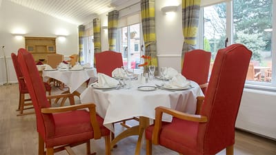 Dining area with tables set for meals