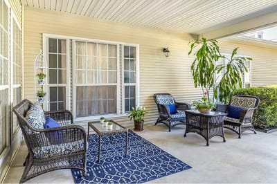 Outdoor seating area with comfortable furniture and plants