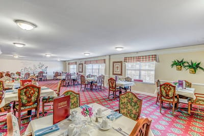 Dining room setup with tables and chairs