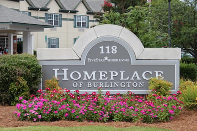 Welcome sign for Homeplace of Burlington with flowers