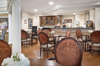 Bright dining area with wooden tables and chairs