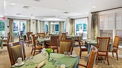 Dining room with tables set for residents