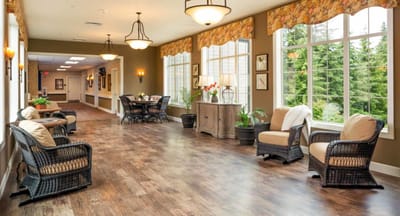 Bright common area with seating and large windows