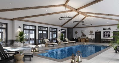 Indoor pool area with lounge chairs and lighting