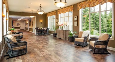Bright common area with seating and large windows