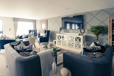 Bright common area with comfortable seating and decor