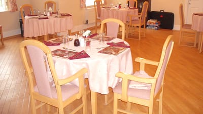 Dining area with tables set for a meal