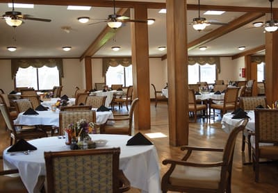 Dining area with tables set for residents