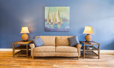 Interior seating area with a couch and lamps