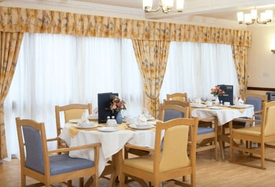 Dining area with tables set for a meal