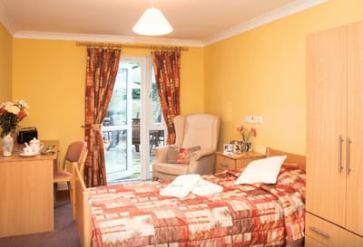 Cozy resident room with bed and seating area