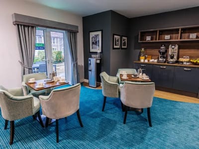Bright common area with dining setup and refreshments