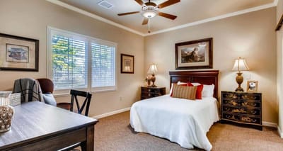Cozy resident room with a bed and desk