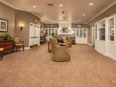 A common area in the memory care facility with seating
