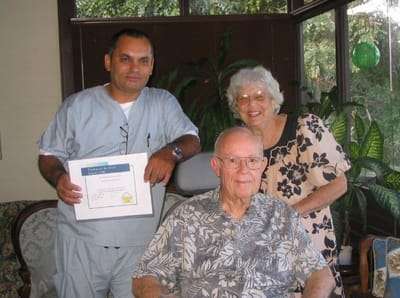 Residents and staff celebrating with an award certificate