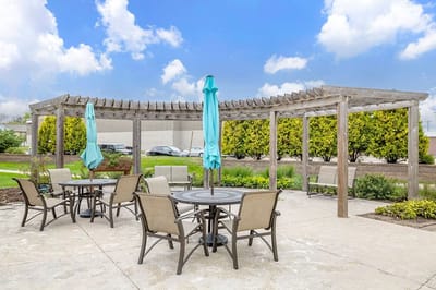 Outdoor patio area with seating and umbrellas