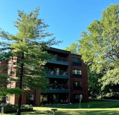 Exterior view of the assisted living facility with green surroundings