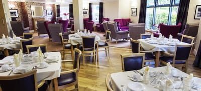 Dining area with tables set for a meal
