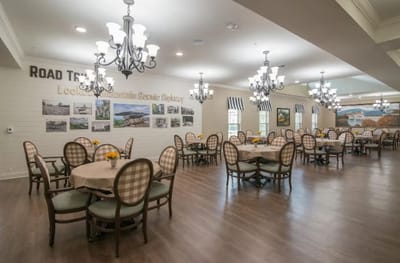 Dining area with tables and chairs in a well-lit room