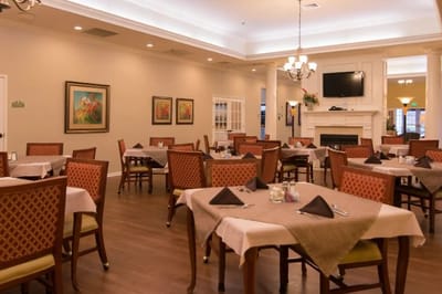 Dining room with tables and chairs set up for meals