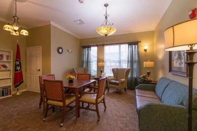 Bright common area with seating and tables