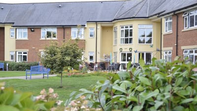 Outdoor view of a care facility with gardens