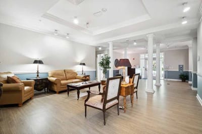 A cozy lounge area with comfortable seating and lighting