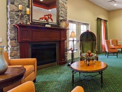 Cozy common area with seating and a fireplace