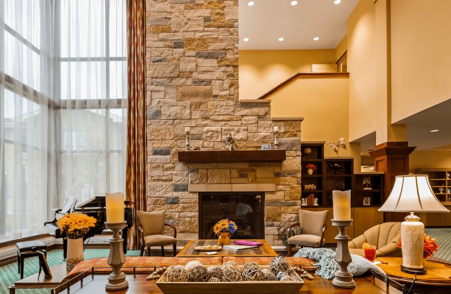 Bright and welcoming common area with stone wall and seating