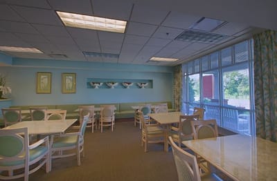 Bright dining area with tables and chairs