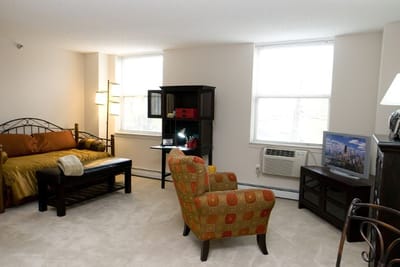 Cozy interior of a private resident room with furniture