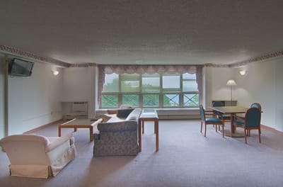 Bright common area with seating and tables