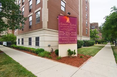 Exterior view of Senior Suites of South Shore building with signage