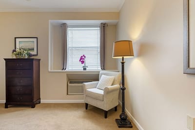 Cozy interior corner with a chair and lamp